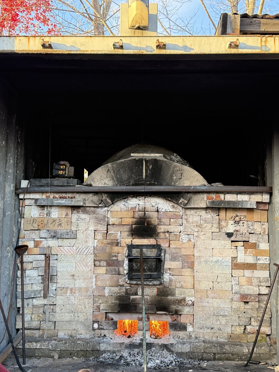 Wood kiln firing in daylight
