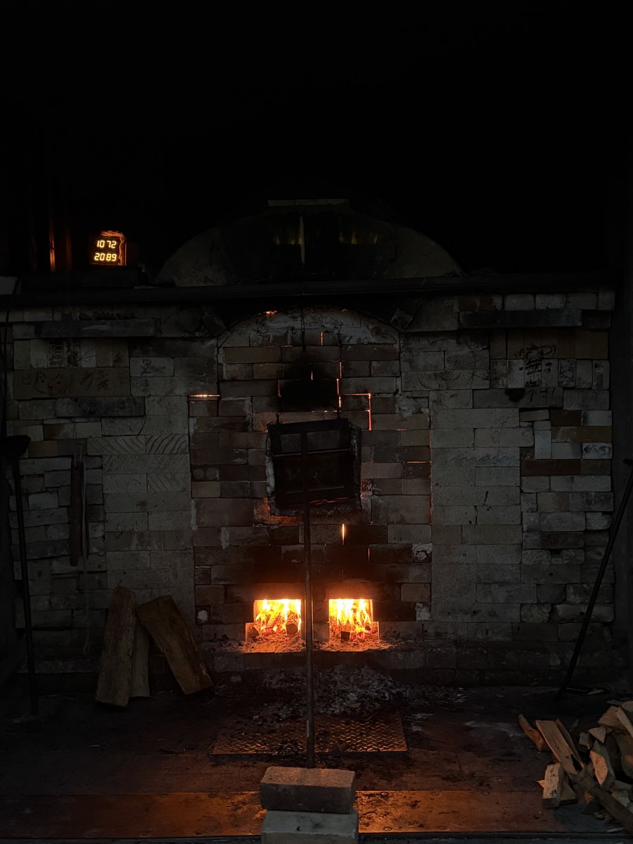 Wood kiln firing at night